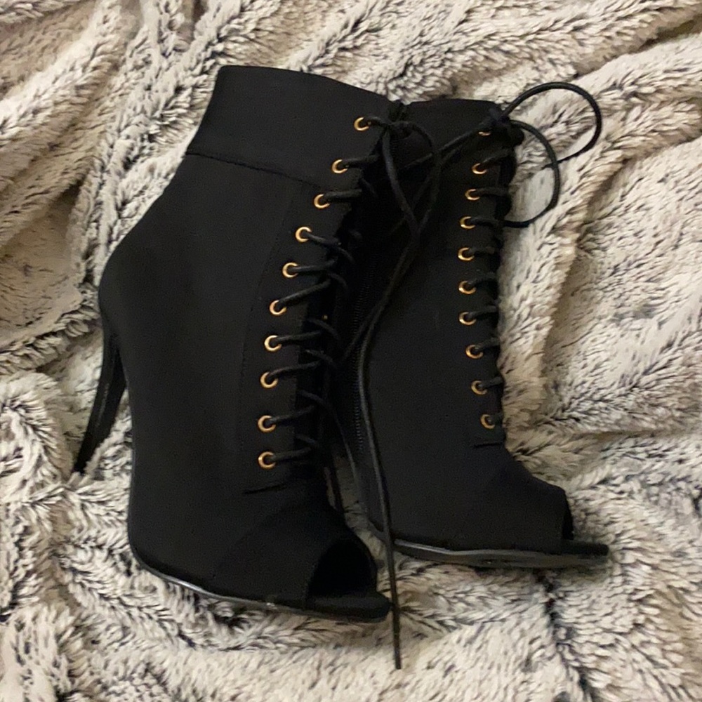 Black lace up heeled open toe boot